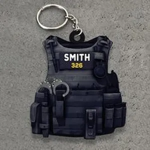 Detailed macro view of a black tactical vest keychain with Smith 326 printed text