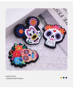 Detailed close-up of colorful Day of the Dead PVC patches including a Mickey silhouette