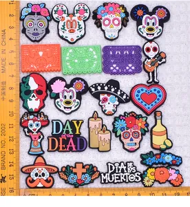 Detailed macro view of colorful Mexico Day of the Dead PVC patches for DIY crafts
