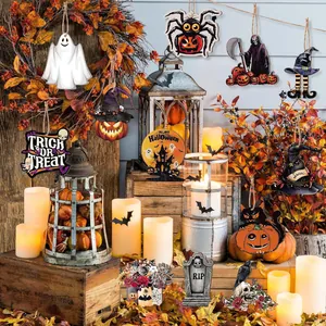 Variety of Halloween wooden hanging ornaments displayed in a festive autumn scene