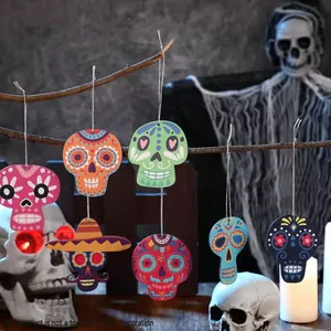 Detail of colourful wood sugar skull hanging ornaments for Cinco de Mayo decoration