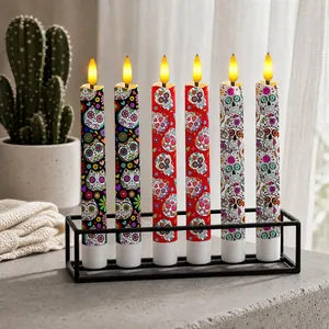 Set of 6 Day of the Dead electronic candles with sugar skull patterns in a black holder