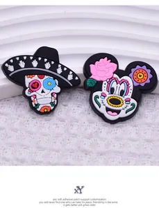 Close-up of Mexican Day of the Dead PVC patches featuring a skull and Minnie Mouse