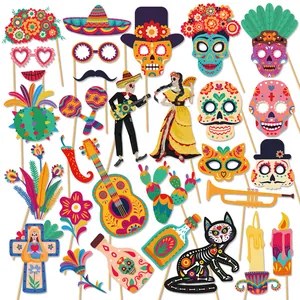 Colorful Day of the Dead photo booth props with sugar skulls and Mexican party motifs