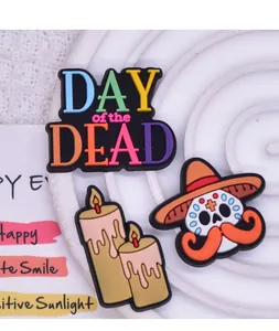 Detailed view of colorful Mexico Day of the Dead PVC charms featuring skull and candles.