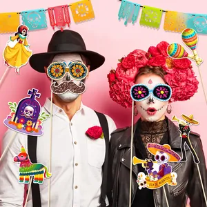 Colorful Day of the Dead photo booth props used by models for festive party photography.