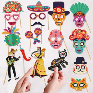 Day of the Dead photo booth props with skulls and Mexican themed party decorations