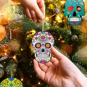 Close-up of vibrant Mexican sugar skull wooden ornament on Christmas tree