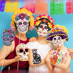 Detailed shot of kids using colorful Mexican Day of the Dead photo booth props