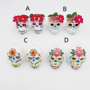 Colorful Day of the Dead skull ornaments with floral designs for festive decoration