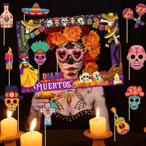 Detailed view of Day of the Dead photo frame and themed handheld props for parties