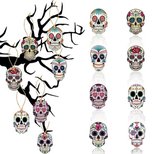 Detailed view of colorful Day of the Dead skull pendants with hanging twine
