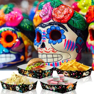 Detail view of Mexican Day of the Dead themed paper snack trays with vibrant skull patterns