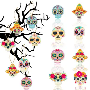 Collection of vibrant Day of the Dead sugar skull hanging ornaments for party decorations.