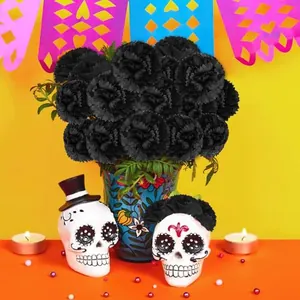 Black artificial marigold flowers used in a festive Day of the Dead altar arrangement