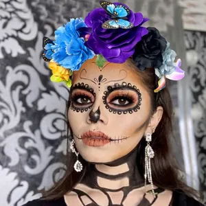 Detailed view of colorful floral headband with butterflies on Day of the Dead model.
