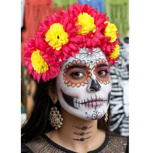 Detailed view of vibrant red and yellow marigold floral headband for Day of the Dead