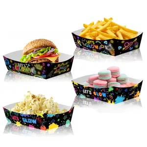 Close-up of neon glow party snack trays holding popcorn, macarons, and fries