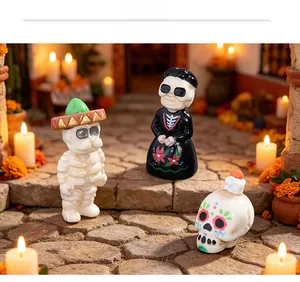Miniature Halloween skeleton figurines set in a festive micro-landscape scene.