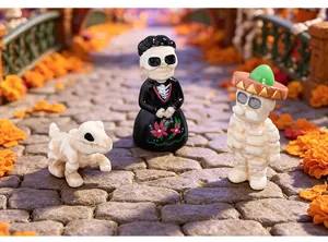 Detailed view of Day of the Dead skeleton figurines in a festive micro landscape scene.