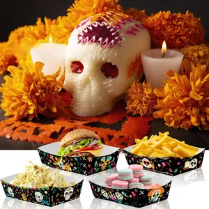 Detailed close-up of Day of the Dead themed paper food trays with vibrant skull patterns.