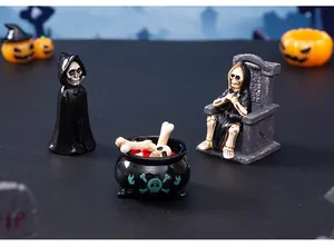 Detailed view of Halloween resin figurines: skeleton on throne, reaper, and cauldron