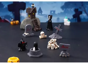 Detailed view of Halloween resin miniature set featuring skulls and spooky figures