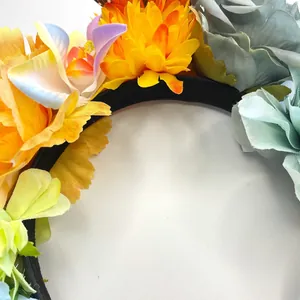 Macro view of vibrant artificial roses and petals on festival carnival party headband