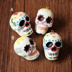 Close-up view of colorful resin sugar skull charms for Halloween DIY jewelry making