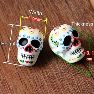 Detailed view of colorful floral skull resin pendant with dimensions 3.7x2.6x3.1cm