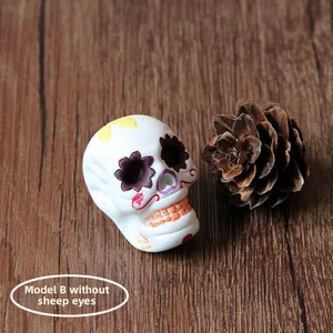 Detailed view of decorated white resin sugar skull for DIY jewelry accessories