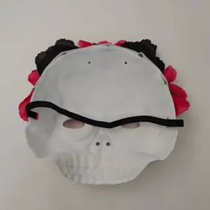 Detailed back view of Halloween skull mask with red and black flowers and elastic strap