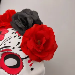 Close-up of fabric flowers on a Day of the Dead skull mask