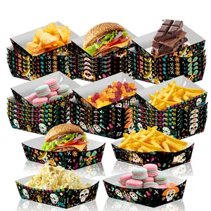 Detailed view of Day of the Dead themed skull pattern paper food trays for parties