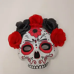 Detailed view of Mexican Day of the Dead mask with red and black flowers
