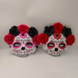 Traditional Mexican Day of the Dead skull masks with artificial roses for Halloween party