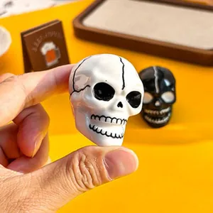 Close-up detail of a realistic white resin skull figure for Halloween DIY craft projects