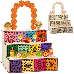 Detailed view of three-tier wooden Day of the Dead altar set with colorful motifs