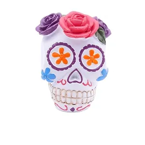 Decorative resin sugar skull figurine with colorful flowers for Day of the Dead decor