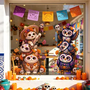 Detailed view of Day of the Dead cat and owl window stickers in a cafe setting