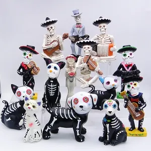 Group of Day of the Dead sugar skull figurines including skeletons and animals.