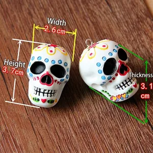 Detail view of Halloween Day of the Dead sugar skull resin charms with measurements