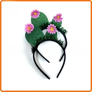 Detailed view of cactus party headbands with pink flowers and green tinsel for festivities.