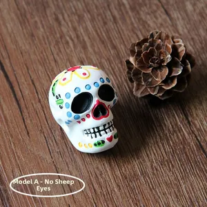 Detailed macro view of a colorful Mexican sugar skull resin charm for Halloween DIY crafts