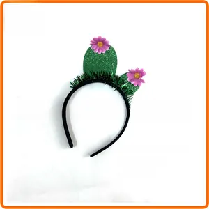 Detailed view of green cactus headband decorated with pink flowers for Day of the Dead