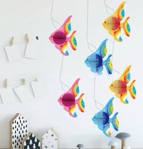 Detail of vibrant tropical fish honeycomb decorations for festive party scenes