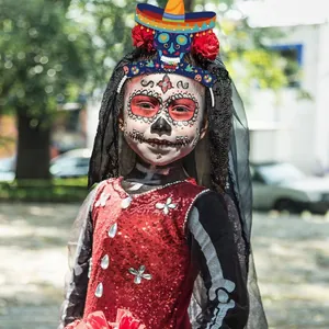 Detail view of colorful Day of the Dead skull headband with mini sombrero and veil