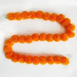 Vibrant orange marigold garland for Halloween and Day of the Dead festival decorations.