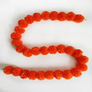 Vibrant orange marigold flower garland for Day of the Dead and Diwali festival decor