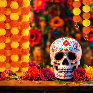 Detailed view of vibrant artificial marigold garlands and decorated sugar skull for festive decor